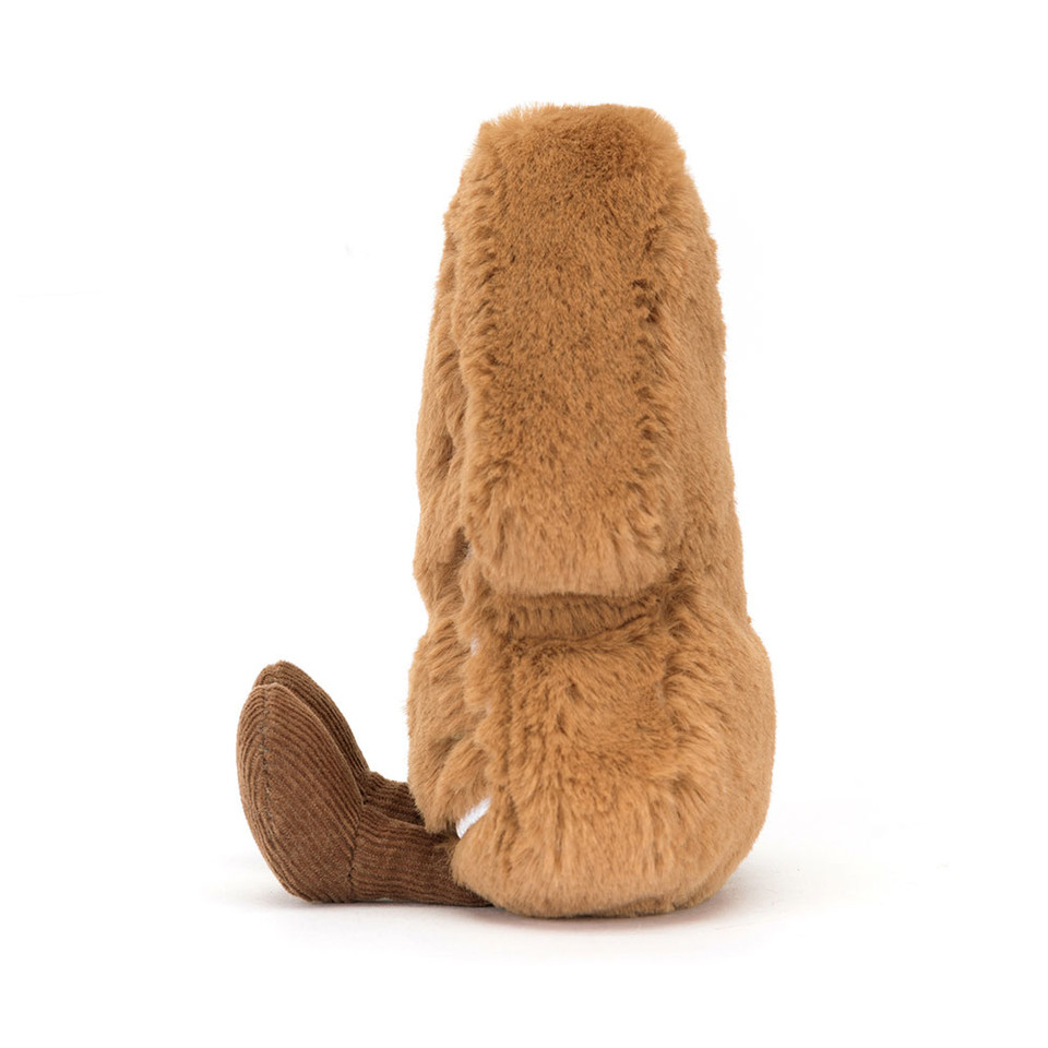 peluche cookie en forme de sapin sur le côté avec un visage qui sourit et avec des petites perle vertes et rouges