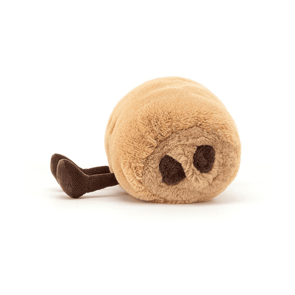 peluche en forme de pain au chocolat sur fond blanc