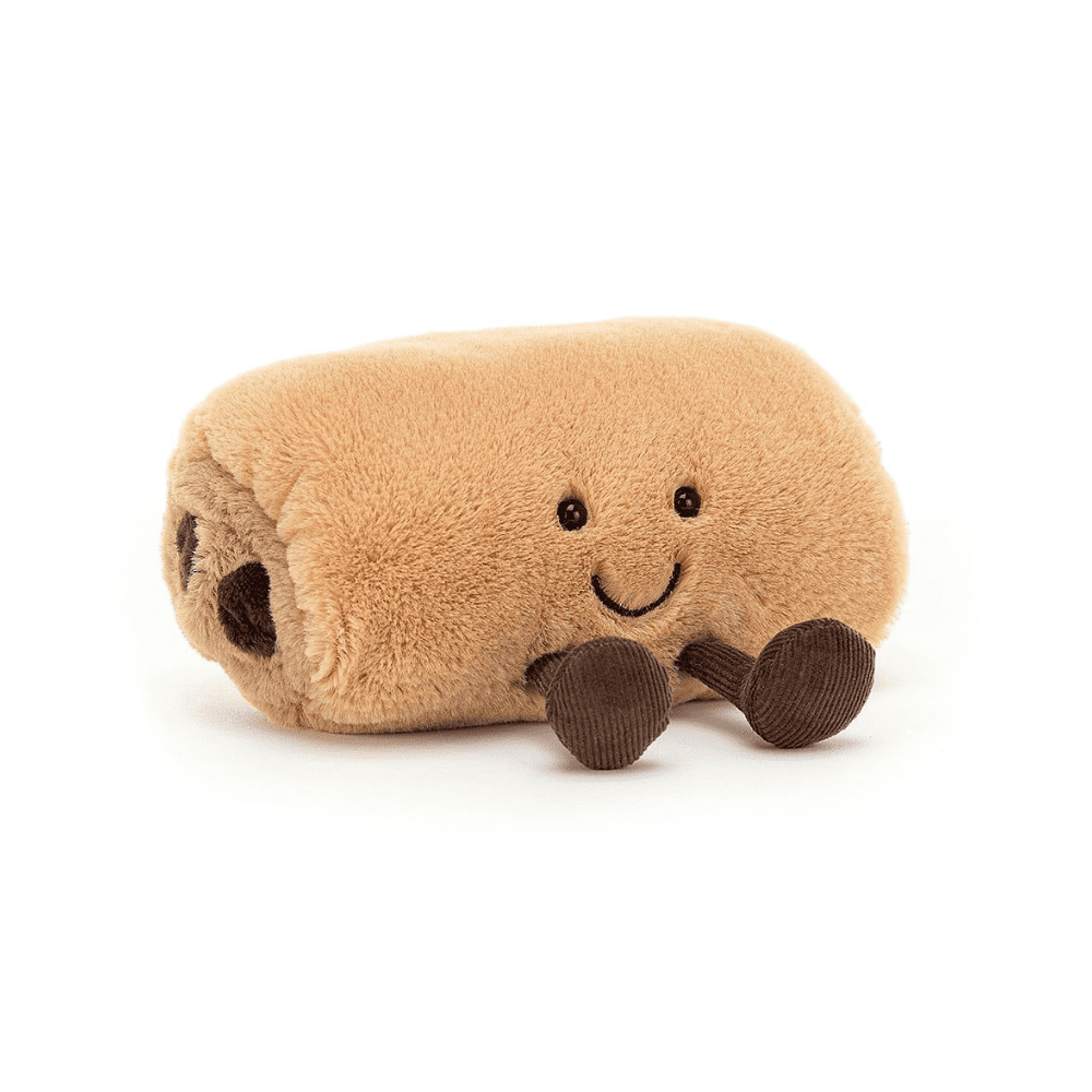 peluche en forme de pain au chocolat sur fond blanc